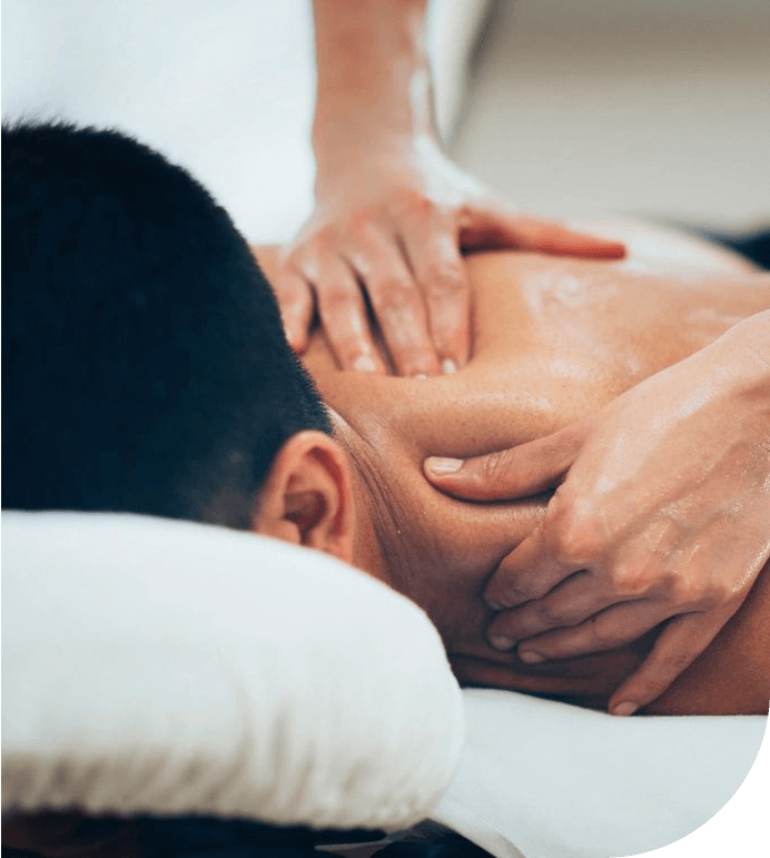 Physical therapist massaging shoulder region