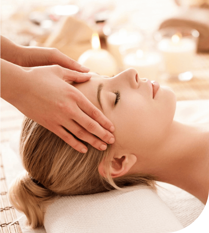 Woman relaxing and having head massage